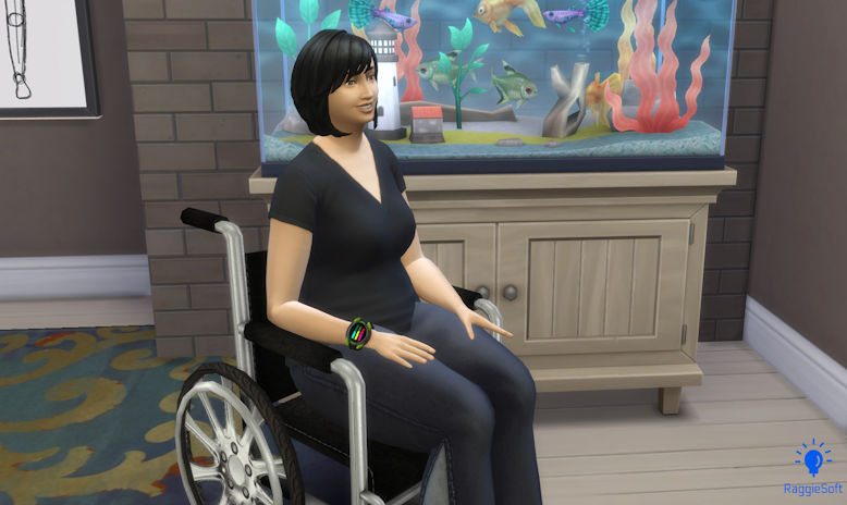 Nichole sitting in a wheelchair in front of a fish tank
